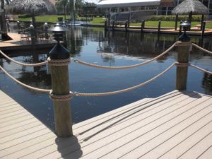 A dock with ropes and a water way