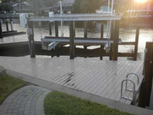 A dock with a bench and a bike rack.