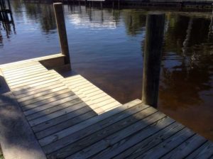 A dock with a wooden board on it