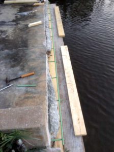 A concrete slab with some green tape on it