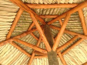 A close up of the ceiling structure of an outdoor gazebo.